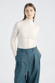 Off white cotton fitted turtleneck