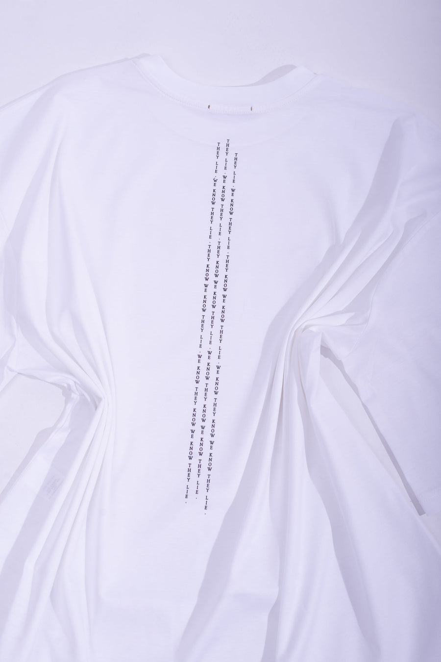 White cotton jersey ''THEY LIE'' boxy t-shirt